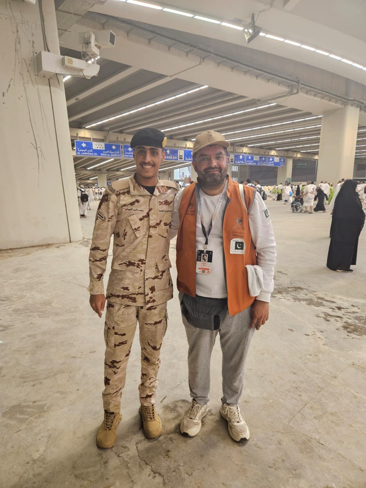 Volunteer with security personnel